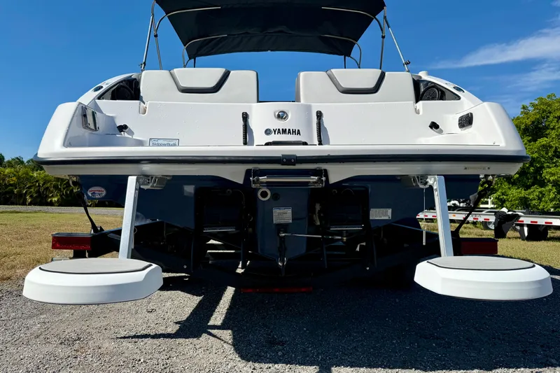 Slide: The Image of 2024 Yamaha Boats SX250 rear view with swim platforms and canopy. - 26