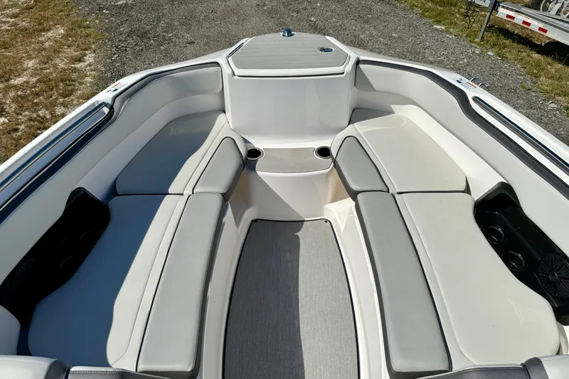 Slide: The Image of 2024 Yamaha Boats SX250 interior with spacious seating and cup holders. - 8