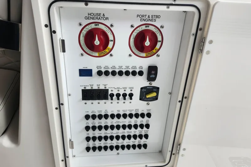 Slide: The Image of Electrical control panel on 2026 Pursuit DC 326 Dual Console boat. - 21