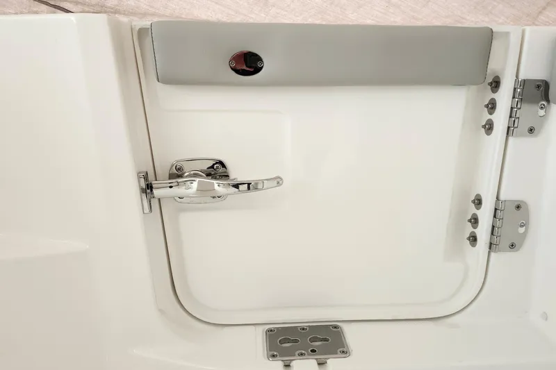 Slide: The Image of 2026 Pursuit DC 326 Dual Console boat door with chrome handle and hinges. - 26