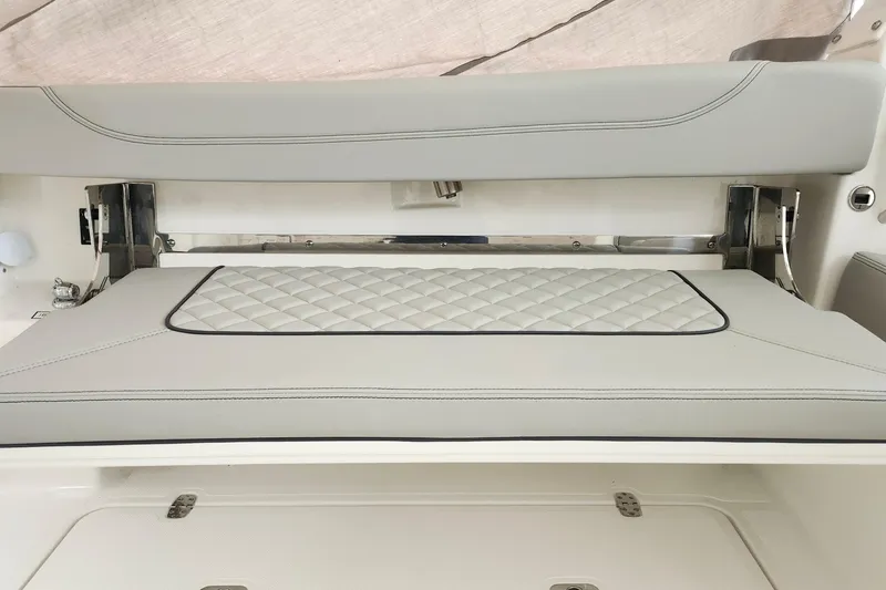 Slide: The Image of 2026 Pursuit DC 326 Dual Console boat seat with quilted upholstery and sleek design. - 30