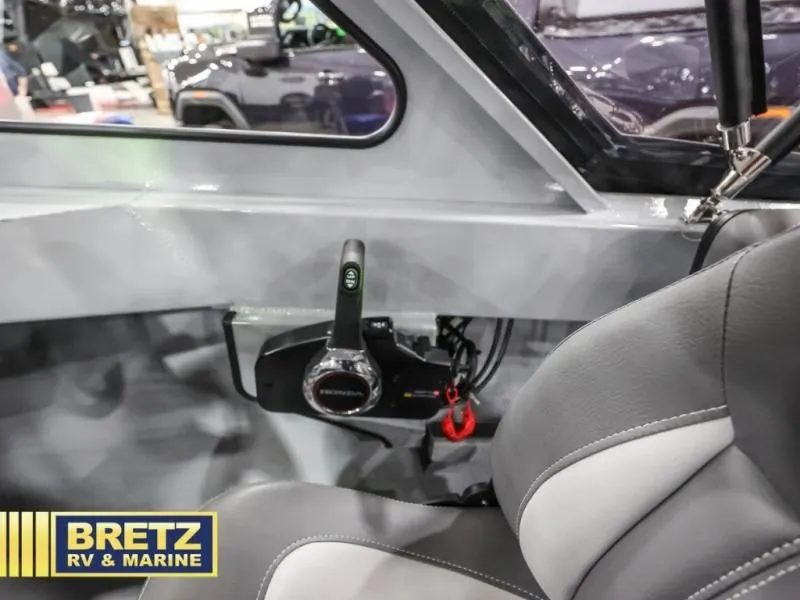 Slide: The Image of Interior of 2026 Hewscraft 160 Sportsman with control console. - 5