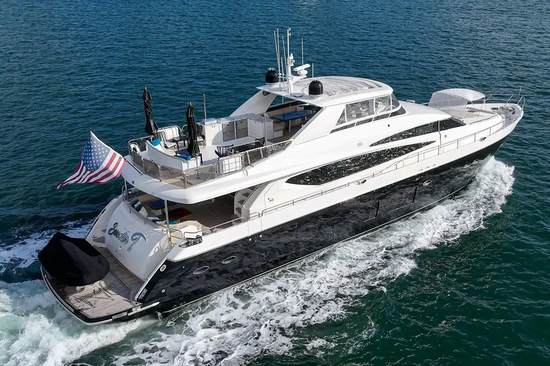 Slide: The Image of Luxurious 2011 Princess 95 Motor Yacht cruising on open water with American flag. - 11