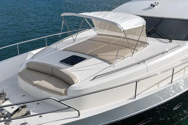 Slide: The Image of 2011 Princess 95 Motor Yacht with sunbathing area and canopy on calm water. - 14