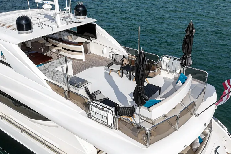 Slide: The Image of Luxurious 2011 Princess 95 Motor Yacht with spacious deck and seating area on the water. - 16