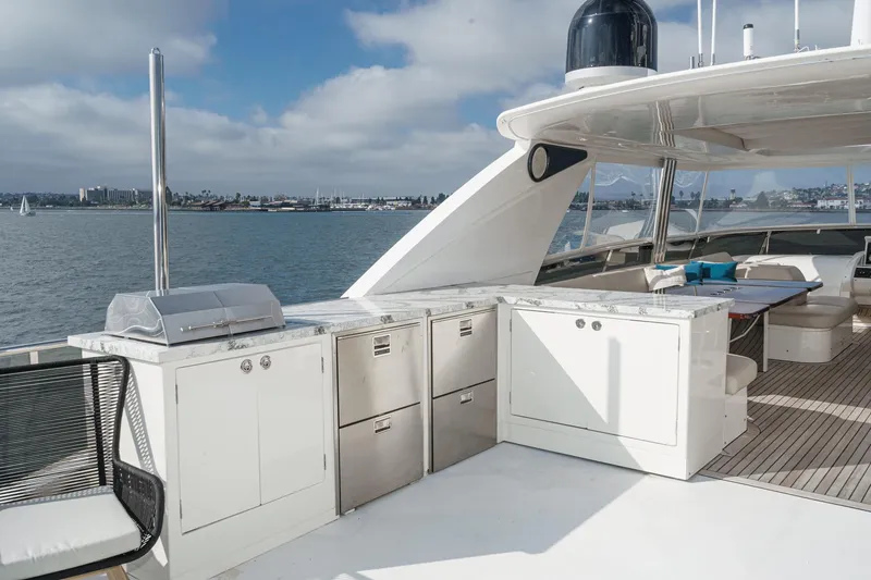 Slide: The Image of Luxurious 2011 Princess 95 Motor Yacht deck with outdoor kitchen and seating area. - 19