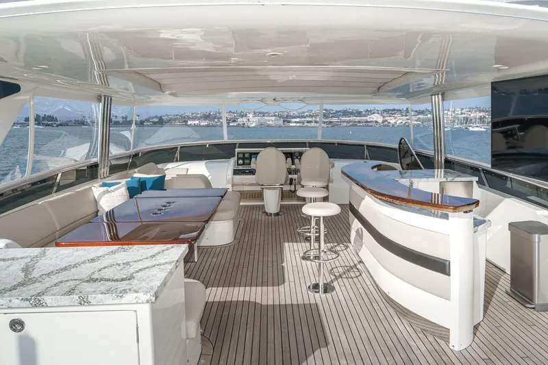 Slide: The Image of Luxurious 2011 Princess 95 Motor Yacht deck with elegant seating and bar area. - 22