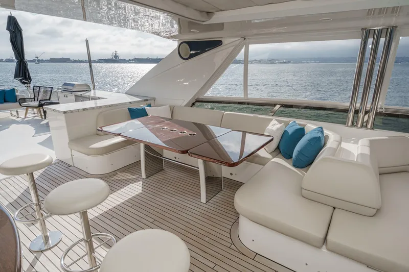 Slide: The Image of Luxurious 2011 Princess 95 Motor Yacht deck with elegant seating and ocean view. - 24
