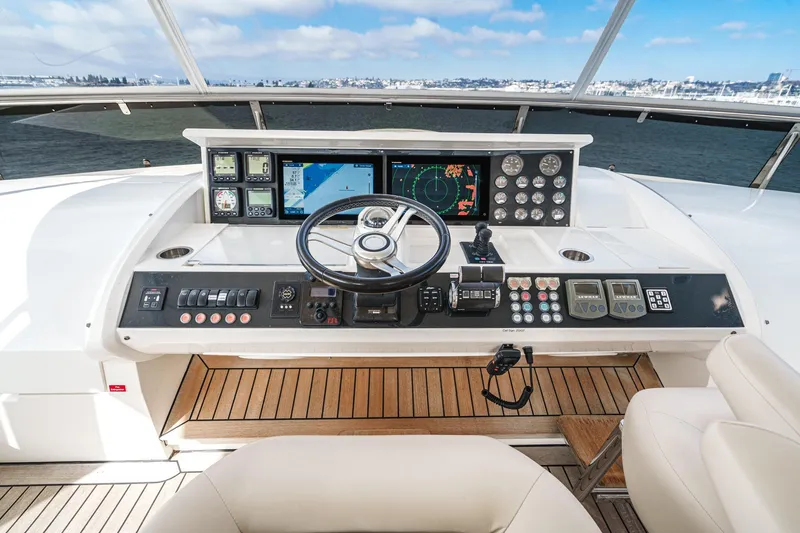 Slide: The Image of Helm of 2011 Princess 95 Motor Yacht with navigation controls and ocean view. - 29