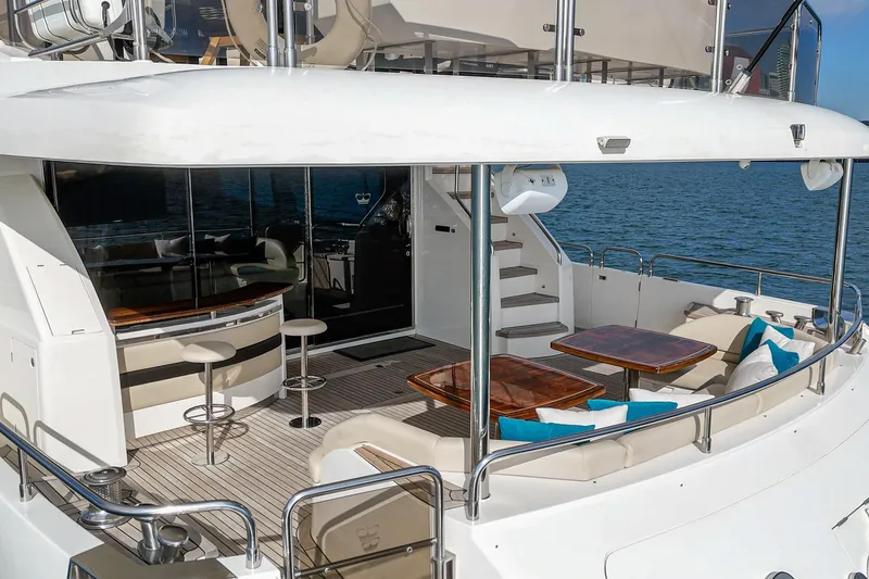 Slide: The Image of Luxurious 2011 Princess 95 Motor Yacht with elegant outdoor seating and bar area. - 30