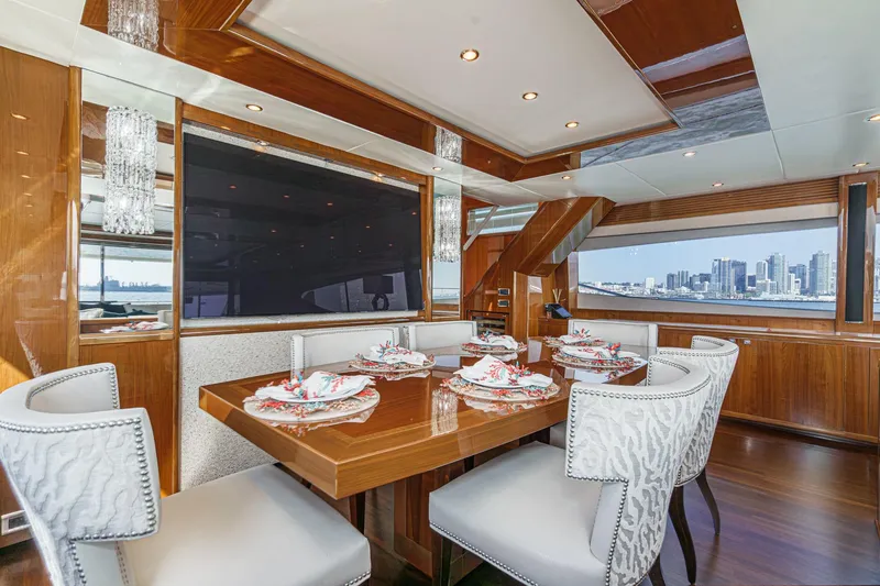 Slide: The Image of Luxurious dining area on a 2011 Princess 95 Motor Yacht with city skyline view. - 42