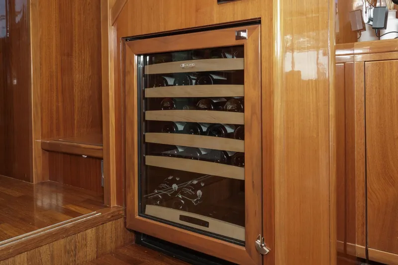 Slide: The Image of Luxurious wooden interior with wine cooler on 2011 Princess 95 Motor Yacht. - 43