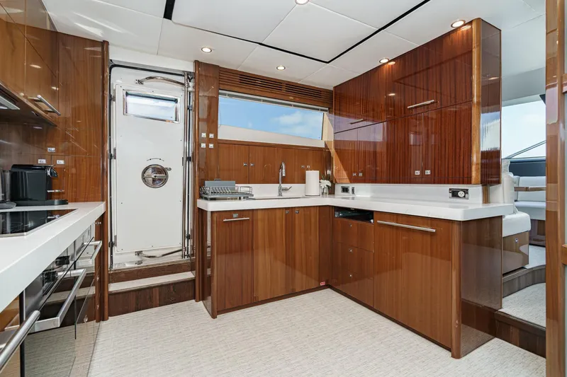 Slide: The Image of Luxurious kitchen interior of 2011 Princess 95 Motor Yacht with modern wood cabinetry. - 45