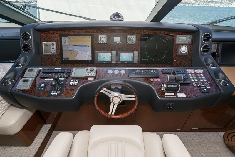 Slide: The Image of Control panel of a 2011 Princess 95 Motor Yacht with navigation and communication systems. - 49