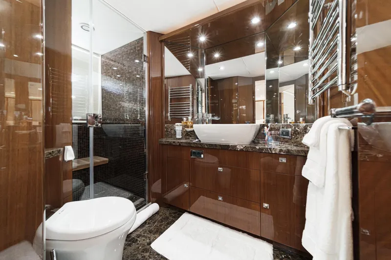 Slide: The Image of Luxurious bathroom in 2011 Princess 95 Motor Yacht with elegant wood finishes and modern fixtures. - 57