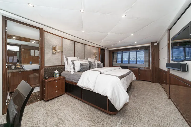 Slide: The Image of Luxurious bedroom interior of 2011 Princess 95 Motor Yacht with elegant furnishings. - 60