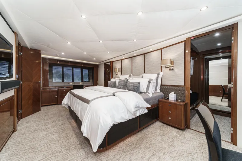 Slide: The Image of Luxurious bedroom interior of 2011 Princess 95 Motor Yacht with elegant furnishings and ambient lighting. - 61