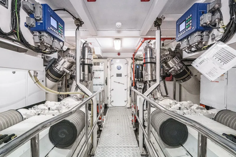 Slide: The Image of Engine room of 2011 Princess 95 Motor Yacht, featuring advanced machinery and control systems. - 65