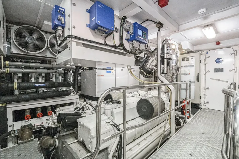 Slide: The Image of Engine room of a 2011 Princess 95 Motor Yacht, featuring advanced machinery and equipment. - 66