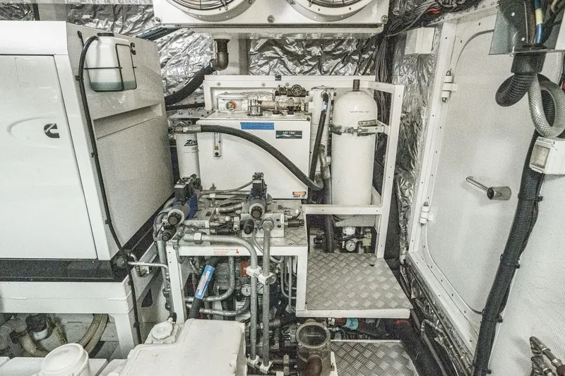 Slide: The Image of Engine room of 2011 Princess 95 Motor Yacht with mechanical equipment and piping. - 68