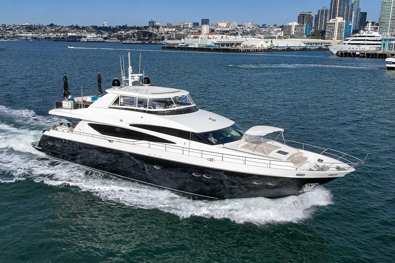 Slide: The Image of 2011 Princess 95 Motor Yacht cruising in a vibrant city harbor. - 7