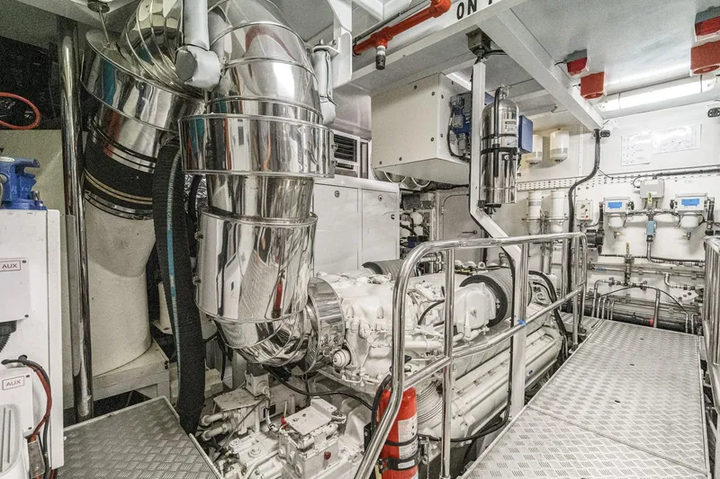 Slide: The Image of Engine room of 2011 Princess 95 Motor Yacht with polished metal components and machinery. - 75