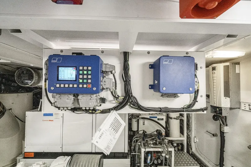 Slide: The Image of Engine room of 2011 Princess 95 Motor Yacht with control panels and wiring. - 77
