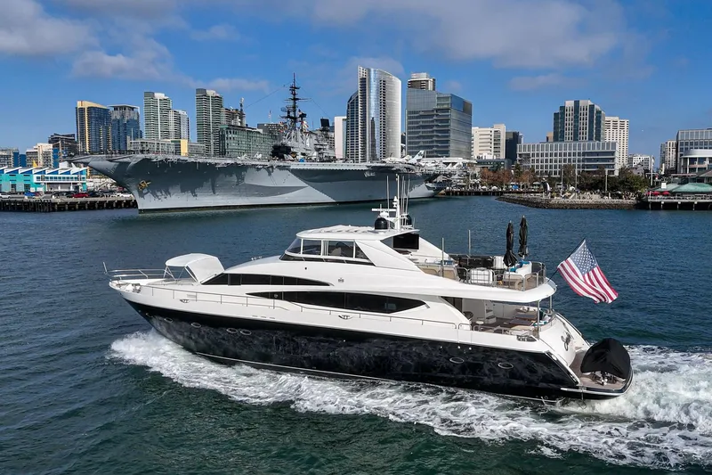 Slide: The Image of Luxury 2011 Princess 95 Motor Yacht cruising near city skyline and naval ship. - 9