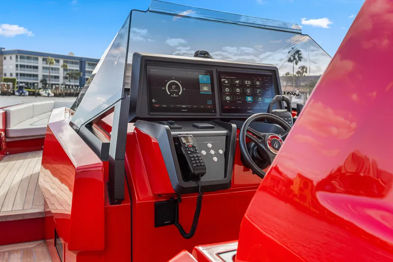 Slide: The Image of Red 2021 Wally 48 yacht helm with advanced navigation system and steering wheel. - 13