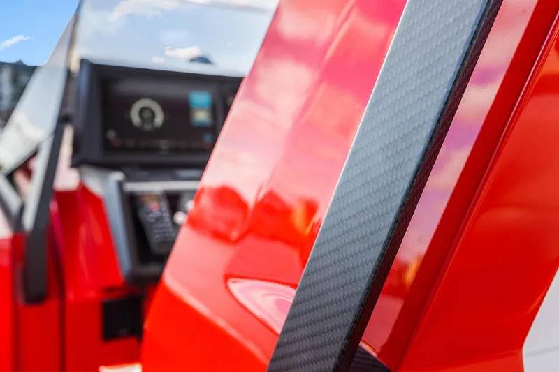 Slide: The Image of Close-up of 2021 Wally 48 yacht dashboard with red and carbon fiber details. - 17