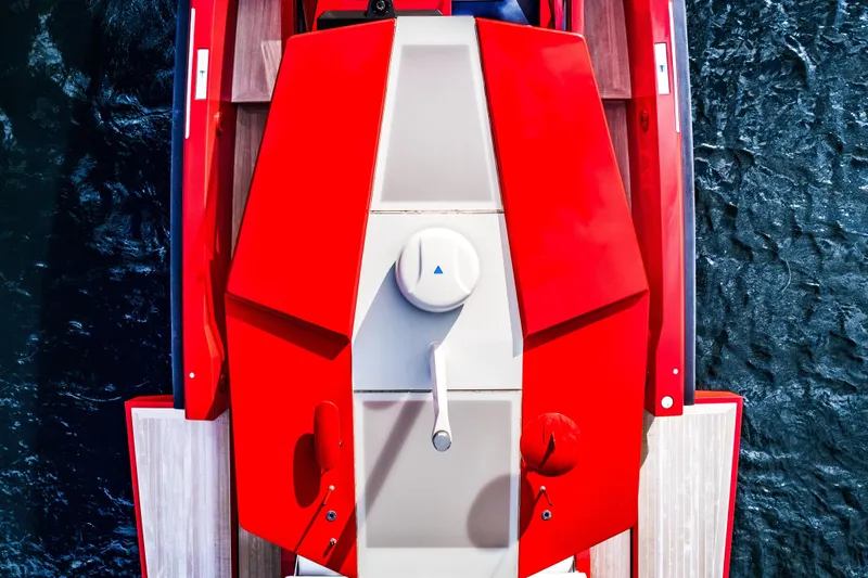 Slide: The Image of Top view of a 2021 Wally 48 boat with striking red design on water. - 25