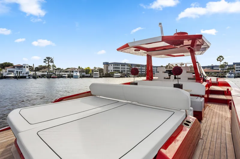 Slide: The Image of 2021 Wally 48 yacht with sleek design, docked in a scenic marina. - 28