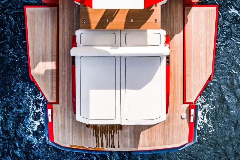 Slide: The Image of Top view of 2021 Wally 48 yacht with wooden deck and white seating. - 32