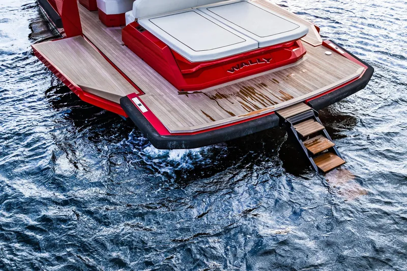 Slide: The Image of Sleek 2021 Wally 48 yacht with wooden deck and swim ladder on water. - 34