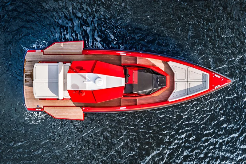 Slide: The Image of Aerial view of 2021 Wally 48 yacht with sleek red design on open water. - 37