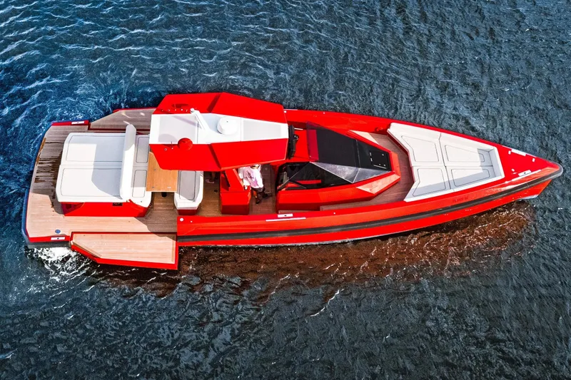 Slide: The Image of Red 2021 Wally 48 yacht cruising on water, featuring sleek design and spacious deck. - 39