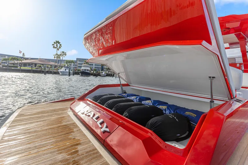 Slide: The Image of Red 2021 Wally 48 yacht with open storage compartment at marina. - 42