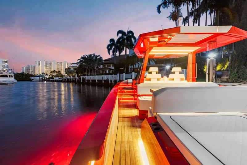 Slide: The Image of Luxury Wally 48 yacht at sunset, featuring sleek design and ambient lighting, 2021 model. - 44