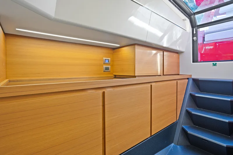 Slide: The Image of Modern interior of 2021 Wally 48 yacht with sleek wooden cabinetry and stairs. - 47
