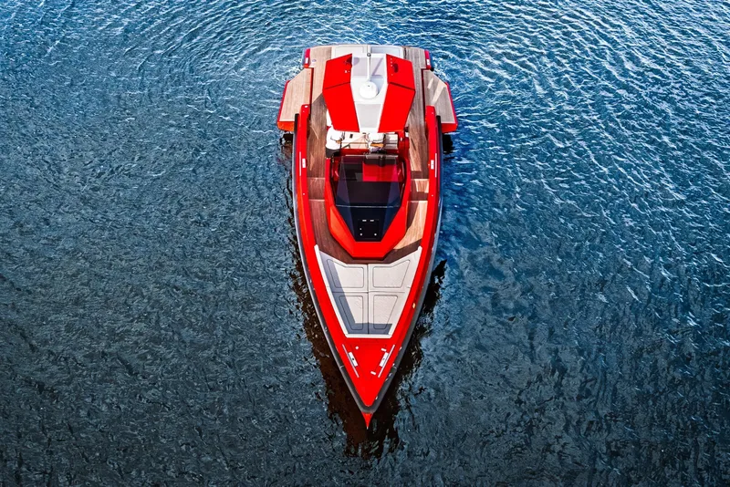 Slide: The Image of Red 2021 Wally 48 yacht on calm blue water, aerial view. - 5