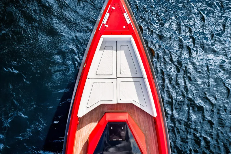 Slide: The Image of Top view of 2021 Wally 48 boat with red deck on blue water. - 8