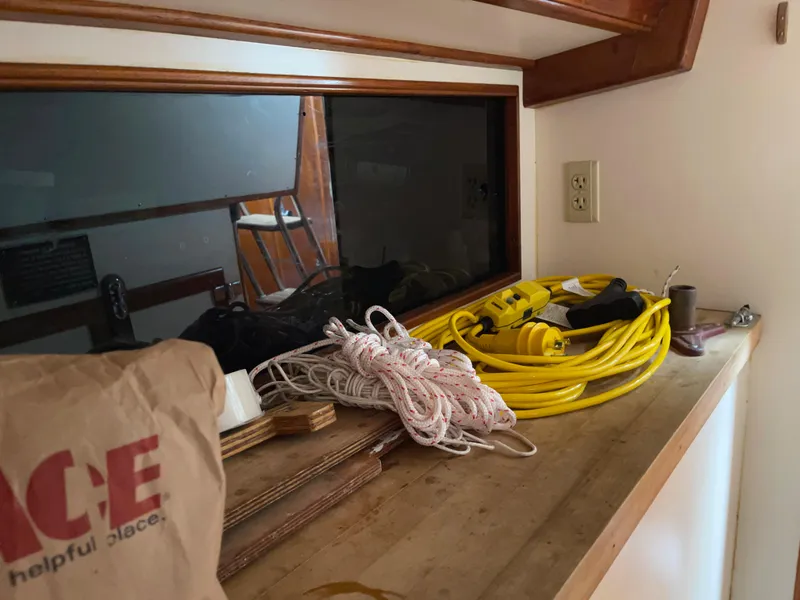 Slide: The Image of Interior of 1985 Chuck Paine Intrepid 40 yacht with ropes and yellow cable on counter. - 15