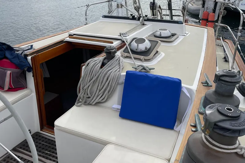 Slide: The Image of 1985 Chuck Paine Intrepid 40 Center Cockpit sailboat deck with ropes and hatch. - 22