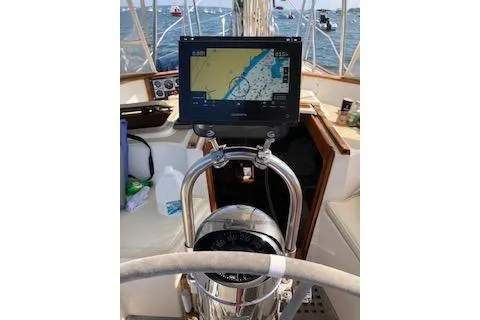 Slide: The Image of 1985 Chuck Paine Intrepid 40 Center Cockpit with navigation system on open sea. - 26