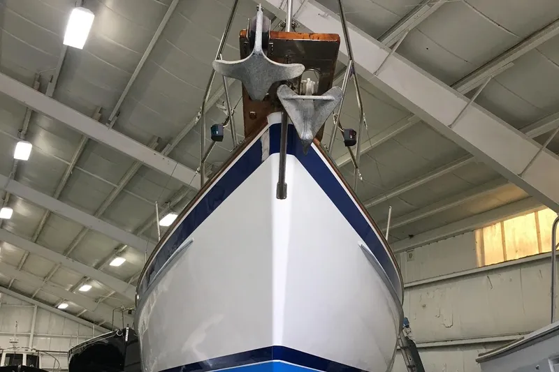 Slide: The Image of 1985 Chuck Paine Intrepid 40 Center Cockpit sailboat in indoor storage facility. - 36