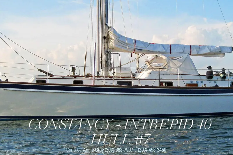 Slide: The Image of 1985 Chuck Paine Intrepid 40 Center Cockpit sailboat on water, side view. - 58