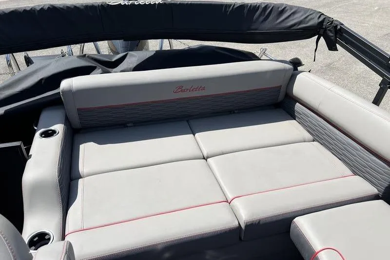 Slide: The Image of 2024 Barletta Corsa 23U boat interior with gray seating and red accents. - 14