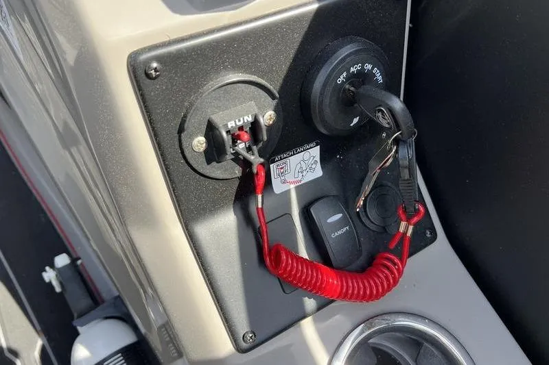 Slide: The Image of 2024 Barletta Corsa 23U ignition panel with safety lanyard and key switch. - 15