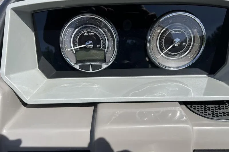 Slide: The Image of 2024 Barletta Corsa 23U dashboard with dual gauges, showcasing RPM and MPH. - 18