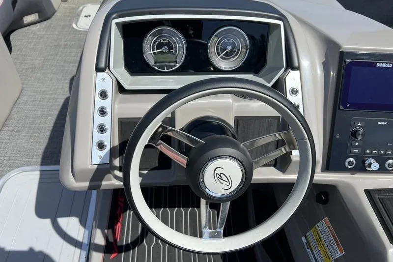 Slide: The Image of 2024 Barletta Corsa 23U dashboard with steering wheel and instrument panel. - 19